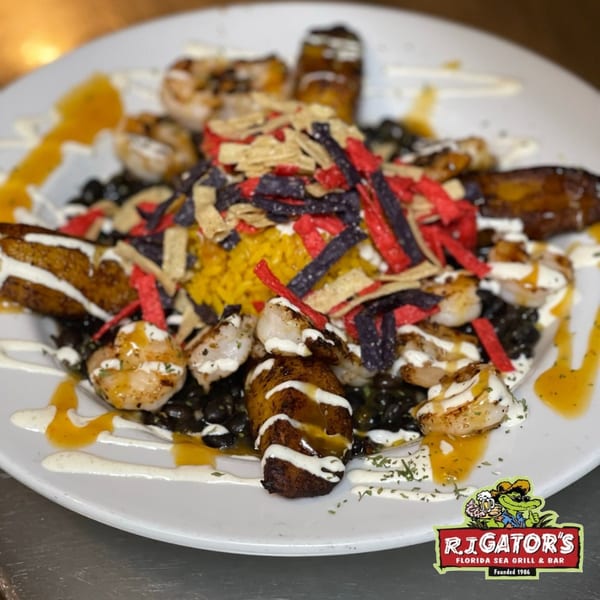 RJ Gator's shrimp and plantain dish with rice, black beans, and tortilla strips.
